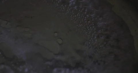 Close-Up view of tiny bubbles forming as water reaches its boiling point. Stock Footage 256284860