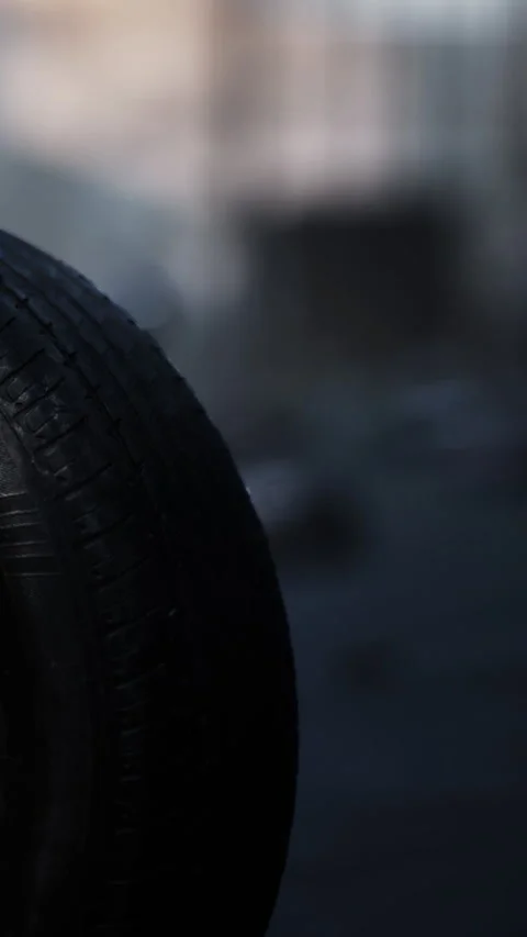 Close view of a tire on a street in an urban area during daytime Stock Footage 342160953