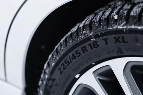 Close up view of tire with tire width, height and wheel diameter designation. 스톡 사진