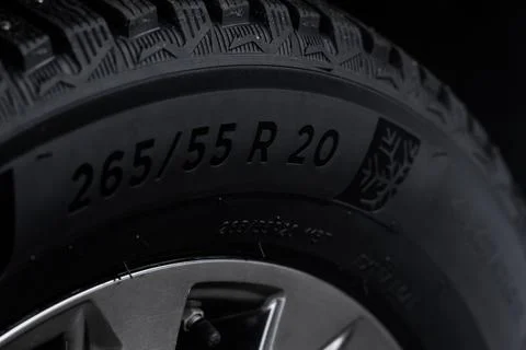Close up view of tire with tire width, height and wheel diameter designation. 스톡 사진