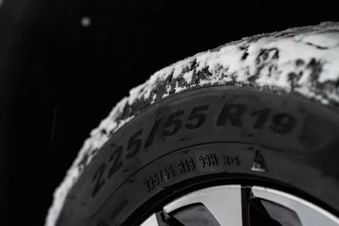 Close up view of tire with tire width, height and wheel diameter designation. 스톡 사진