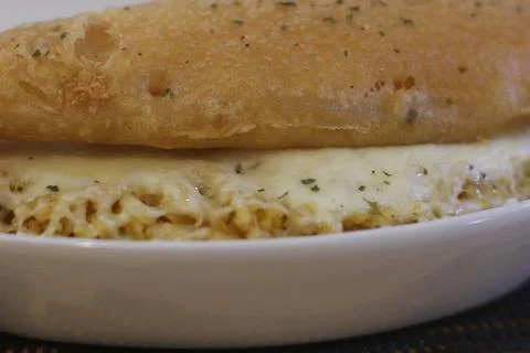 Close up view of a toasted bread sandwich with creamy egg filling visible alo Stock Photos