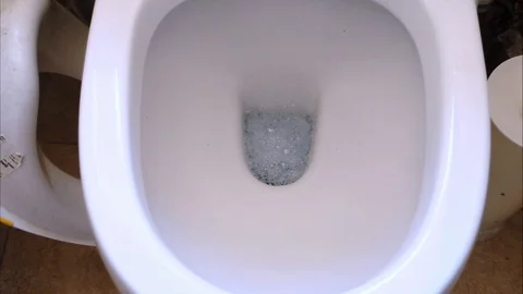 Close up view of a toilet flushing Stock Footage 104453867