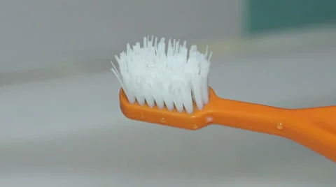 Close-up View of Toothpaste being Squeezed on to a Toothbrush. Full HD Stock Footage 47179161