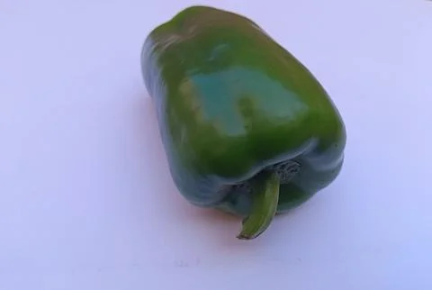 Close up view from top of Green capsicum on an isolated white background. Stock Photos