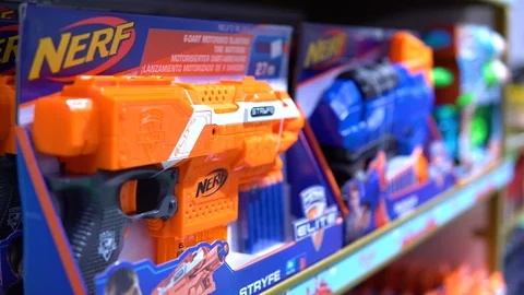 A close up view of toy gun Nerf, displayed on a shelf. Video stock 124730163