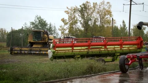 Close view of tractors and mowing equipment in the field. Stock Footage 133347541