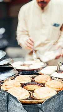 Close-up view. The traditional baking process of Khamir pancake Stock Photos