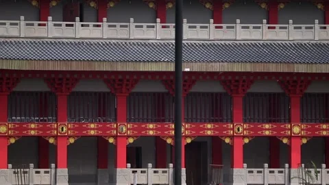 Close view of traditional building facade with red pillars Stock Footage 332612770