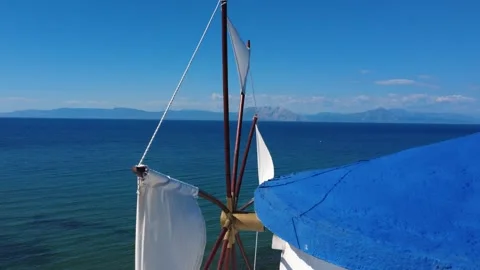Close up view of a traditional white windmill on an island horizon. Stock Footage 343939573