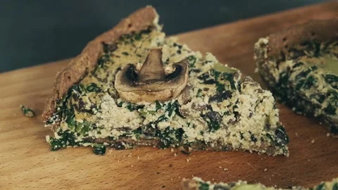 Close up view on triangular piece of tasty healthy pie with mushrooms, basil Video stock 136182525