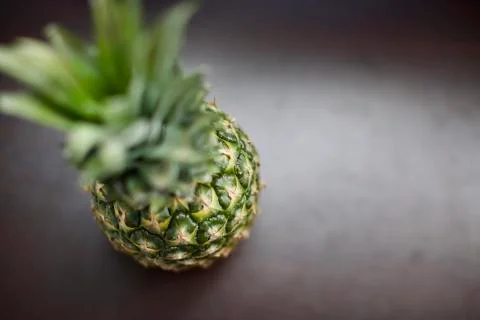 Close up view of tropical fruit pineapple. Blurry background Stock Photos