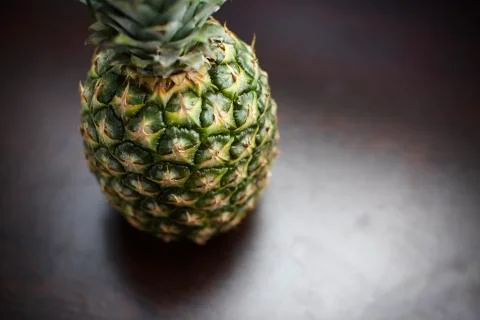Close up view of tropical fruit pineapple. Blurry background Stock Photos
