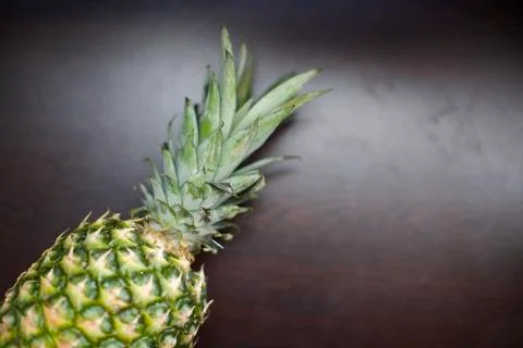 Close up view of tropical fruit pineapple. Blurry background Stock Photos