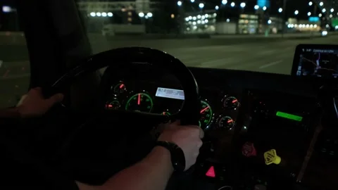 Close up view of Truck driver rides to destination cargo at road on night. Slow Stock Footage 155569909