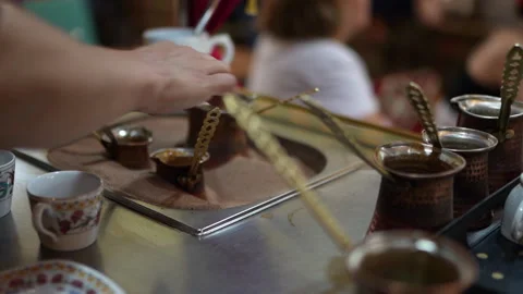 A close-up view of Turkish coffee brewing using a sand technique Video stock 325398181