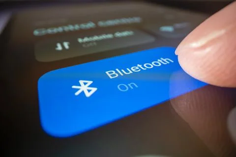 Close-up view of turning on Bluetooth on a smartphone Stock Photos