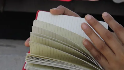 Close view of turning over pages of a notebook 스톡 동영상 132523728
