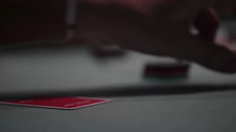 Close up view of two cards during a Texas hold 'Em poker game with defocused bac Stock Footage 328320842