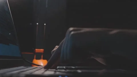 Close up view of two fingers slowly pressing computer keyboard buttons in dark l Stock Footage 161038109