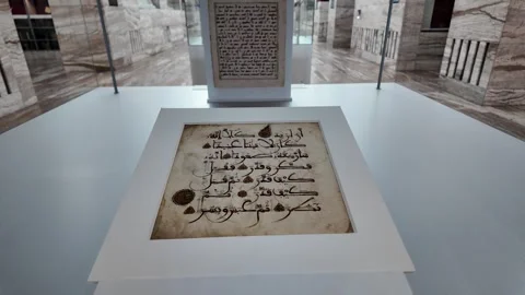 A close-up view of two historical Arabic calligraphic manuscripts preserved in Stock Footage 336814418