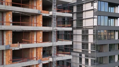 Close-up view of two modern residential buildings under construction. One facade Video stock 310182519