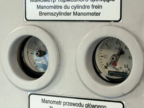 Close-up view of two pressure gauges on a train, displaying readings for br.. Stock Photos