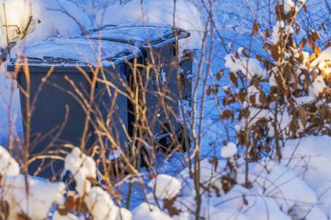 Close up view of two snow covered waste bins for garbage sorting in villa Fotos de archivo