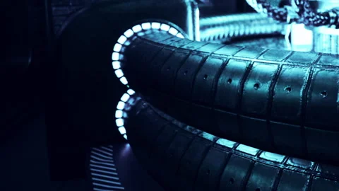 Close view of two tires in a futuristic setting at night Stock Footage 343554512