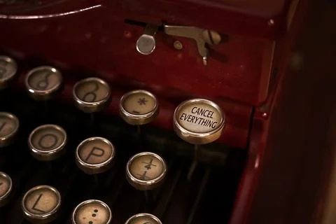 Close up view of a typewriter keyboard. Focus on the key "CANCEL EVERYTHING". Stock Photos