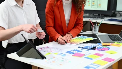 Close up view of UI developer team brainstorming on their project with lapt.. Stock Footage 312387081