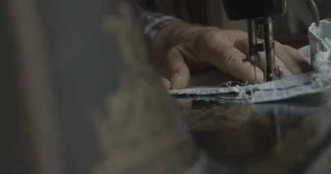 Close-up view of the unknown male hands sewing on the hand-sewn machine. No face Stock Footage 123504860