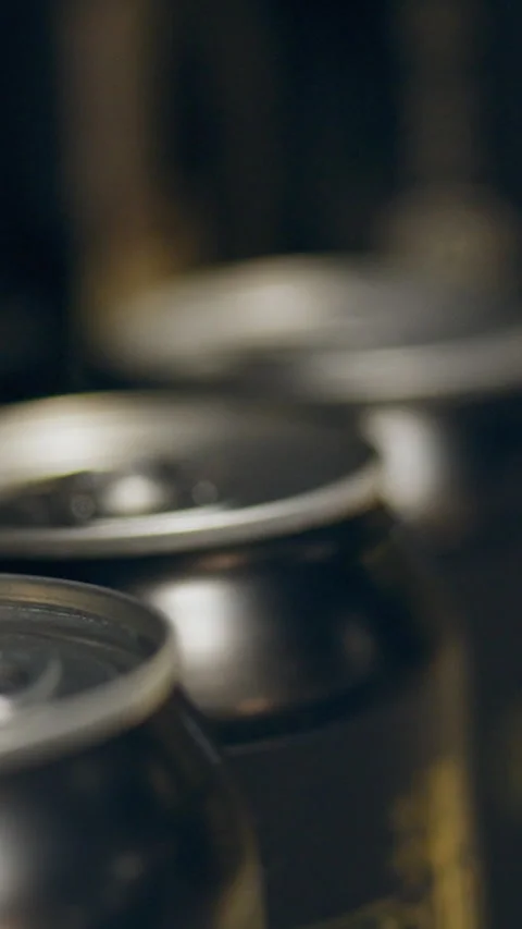 Close-up view of unopened beverage cans lined up in a storage area within an Stock Footage 331534025