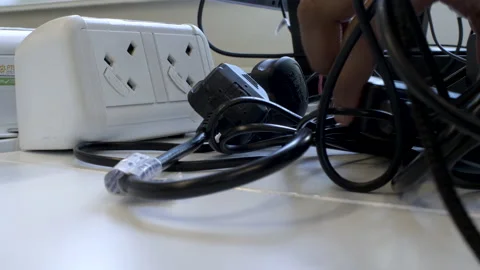 Close Up View Of Unplugging Electronic Devices from Electricity Socket, Stock Footage 200682542