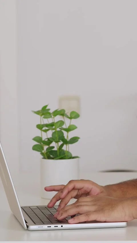 Close up view of unrecognizable person hands typing on laptop at home Video stock 345093267