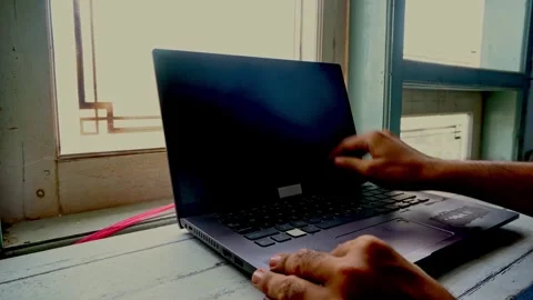 A close up view of an unrecognizable person opening their modern laptop com.. Stock-Footage 345139062