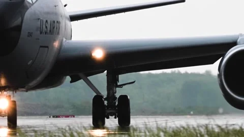 Close up view of U.S. Air Force KC-135 Stratotanker turning on wet runway  Stock Footage 276089200
