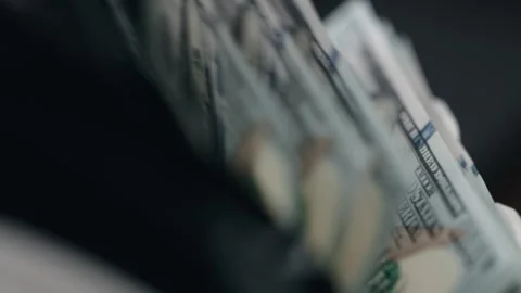 Close-up view of US currency notes being organized in a wallet, showcasing the Stock Footage 333979125