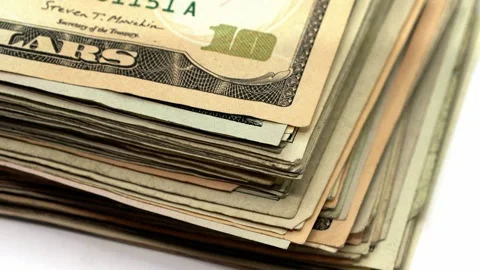 Close-up view of US dollar banknotes growing layer by layer showing money on Stock Footage 343351466