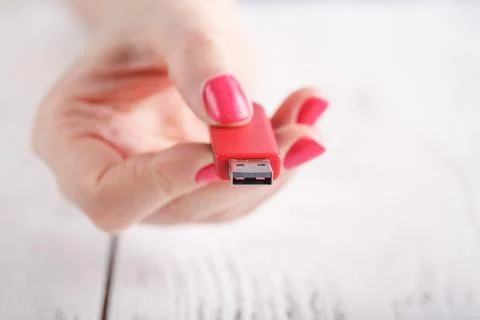 Close up view of usb flash pendrive in female hand Stock Photos