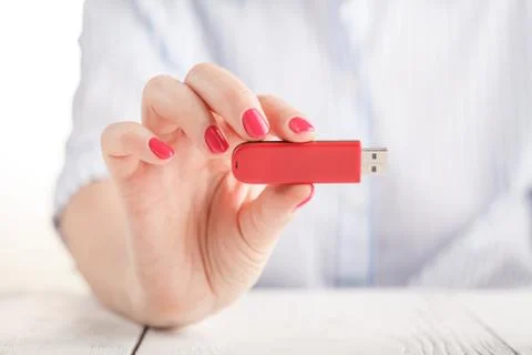 Close up view of usb flash pendrive in female hand Stock Photos