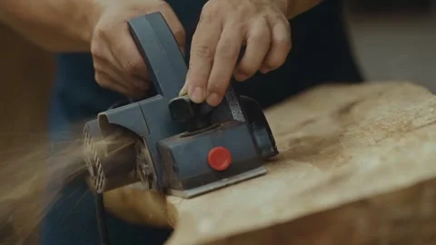 Close up view of using an electric hand planer Stock Footage 266865910
