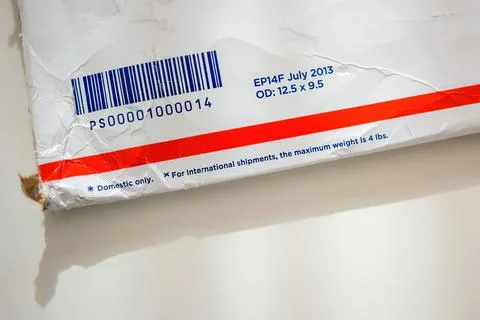 Close-up view of USPS United States Postal Service Parcel envelope with barcode 스톡 사진