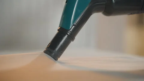 Close view of vacuum removing dirt from soft fabric. Thorough mattress and Stock Footage 336864230