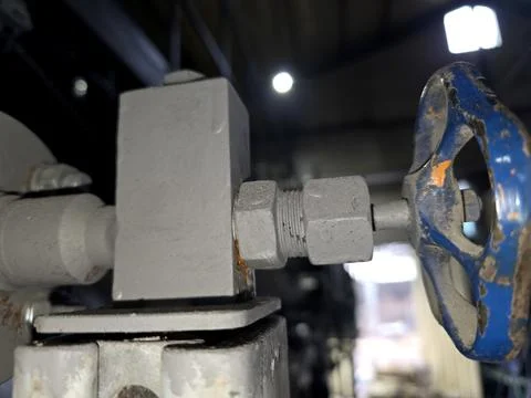 Close up View of a Valve and Pipe Fitting in an Industrial Setting With Dim.. Stock Photos