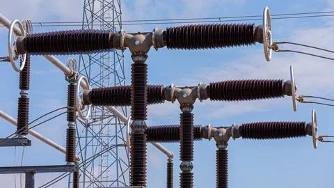 Close up view of various elements and high-voltage insulators of a transforme Stock Photos