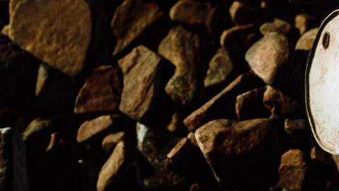 Close up view of various rocks on dark surface in different shapes and sizes Stock Footage 340023841