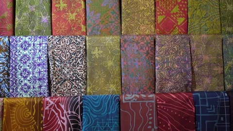 Close-up view of the various types of batik material men shirt. 動画素材 267934502