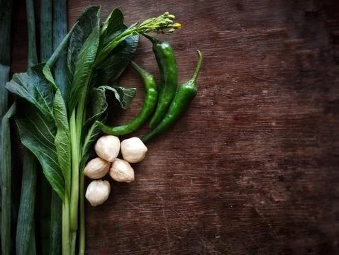 Close up view of vegetables on brown table Stock Photos