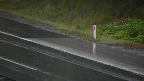 Close up view of vehicles leaving a wet trail with water splashes Stock Footage 164687463